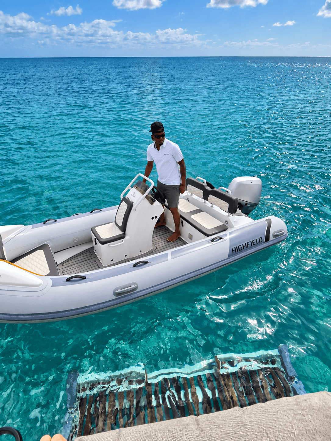 Jaden aboard the Breezy Days tender on the turquoise water of Barbados