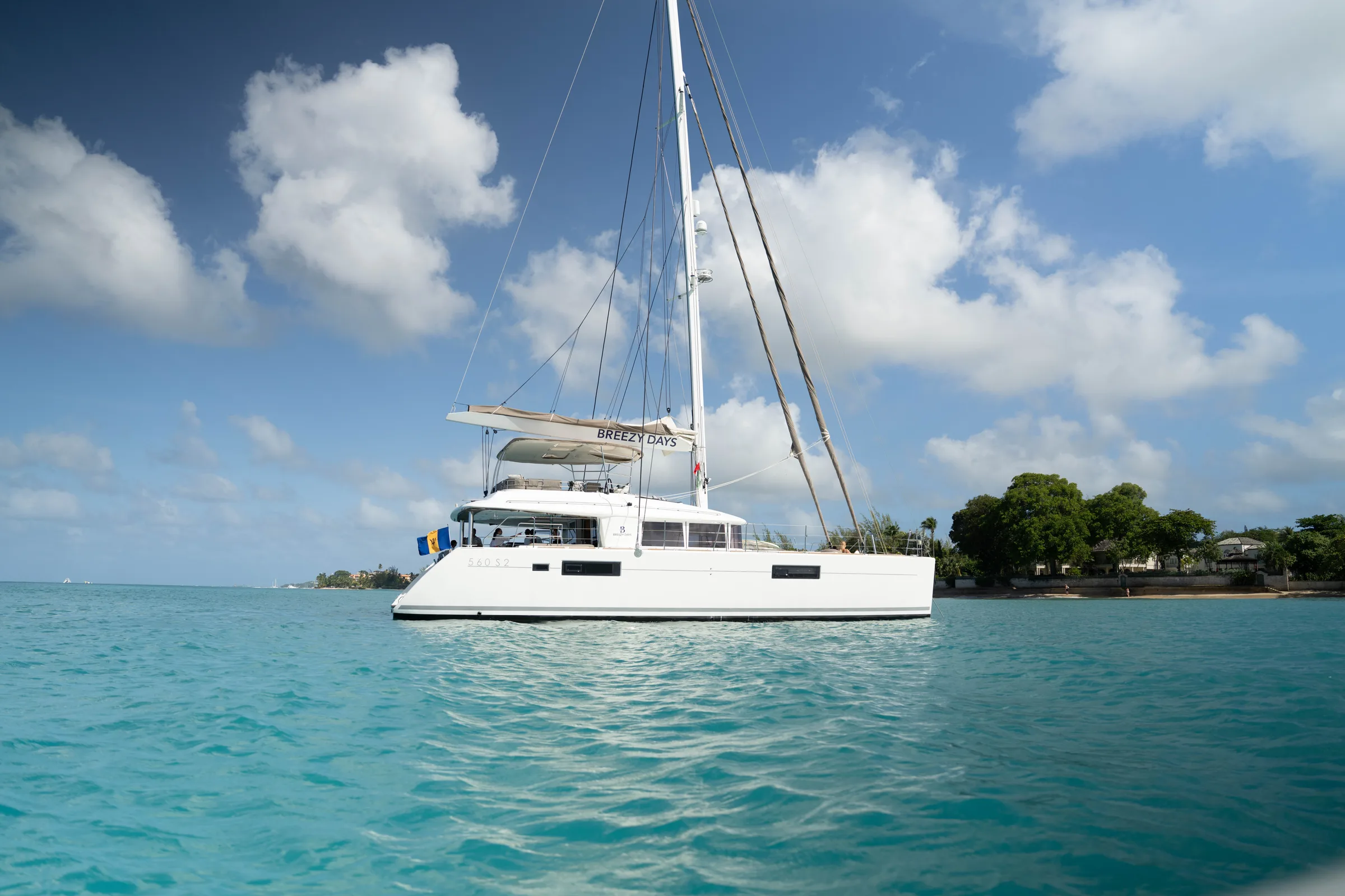 Breezy Days catamaran sailing along the Barbados coast