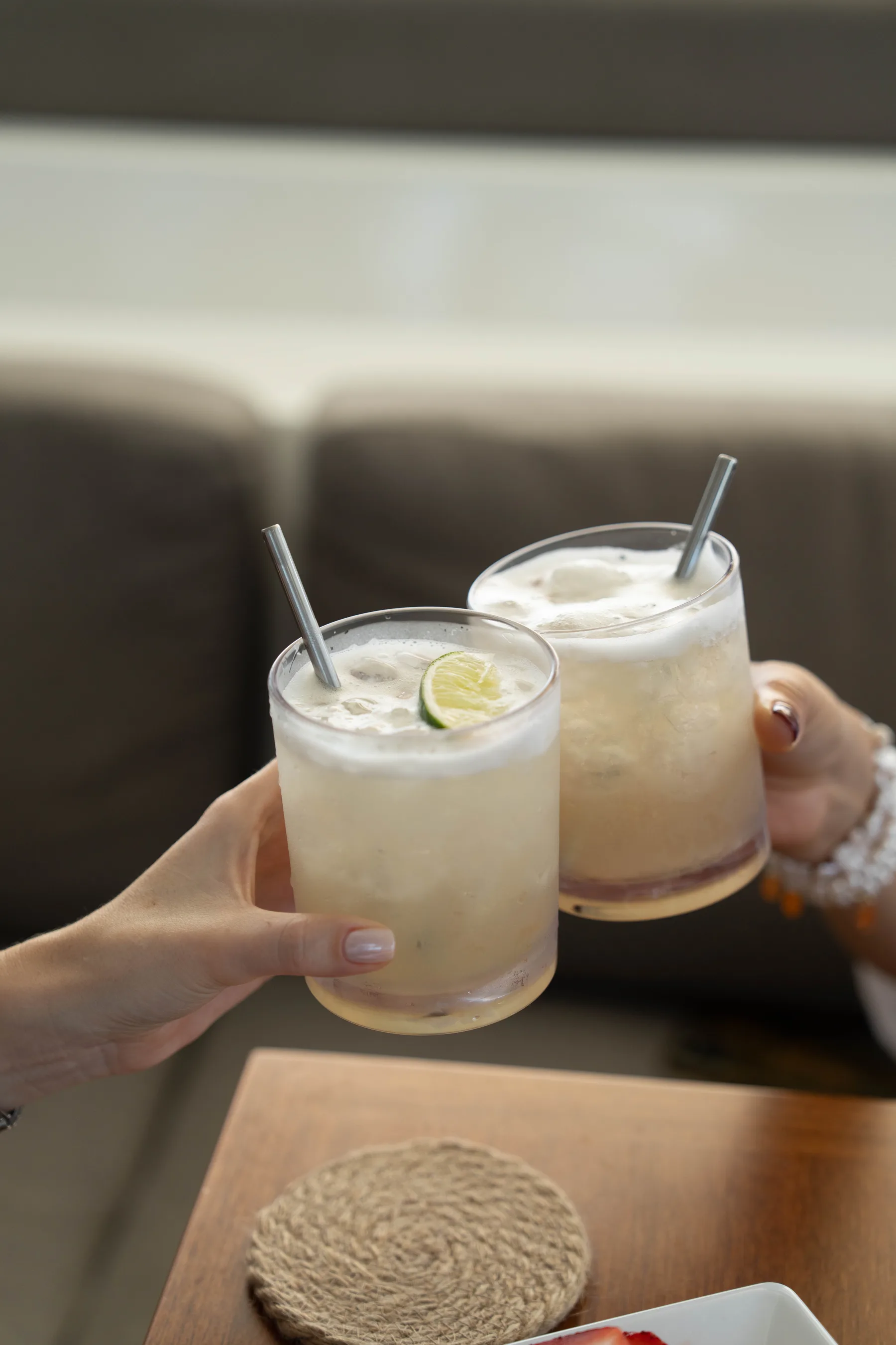 Two cocktails raised on board